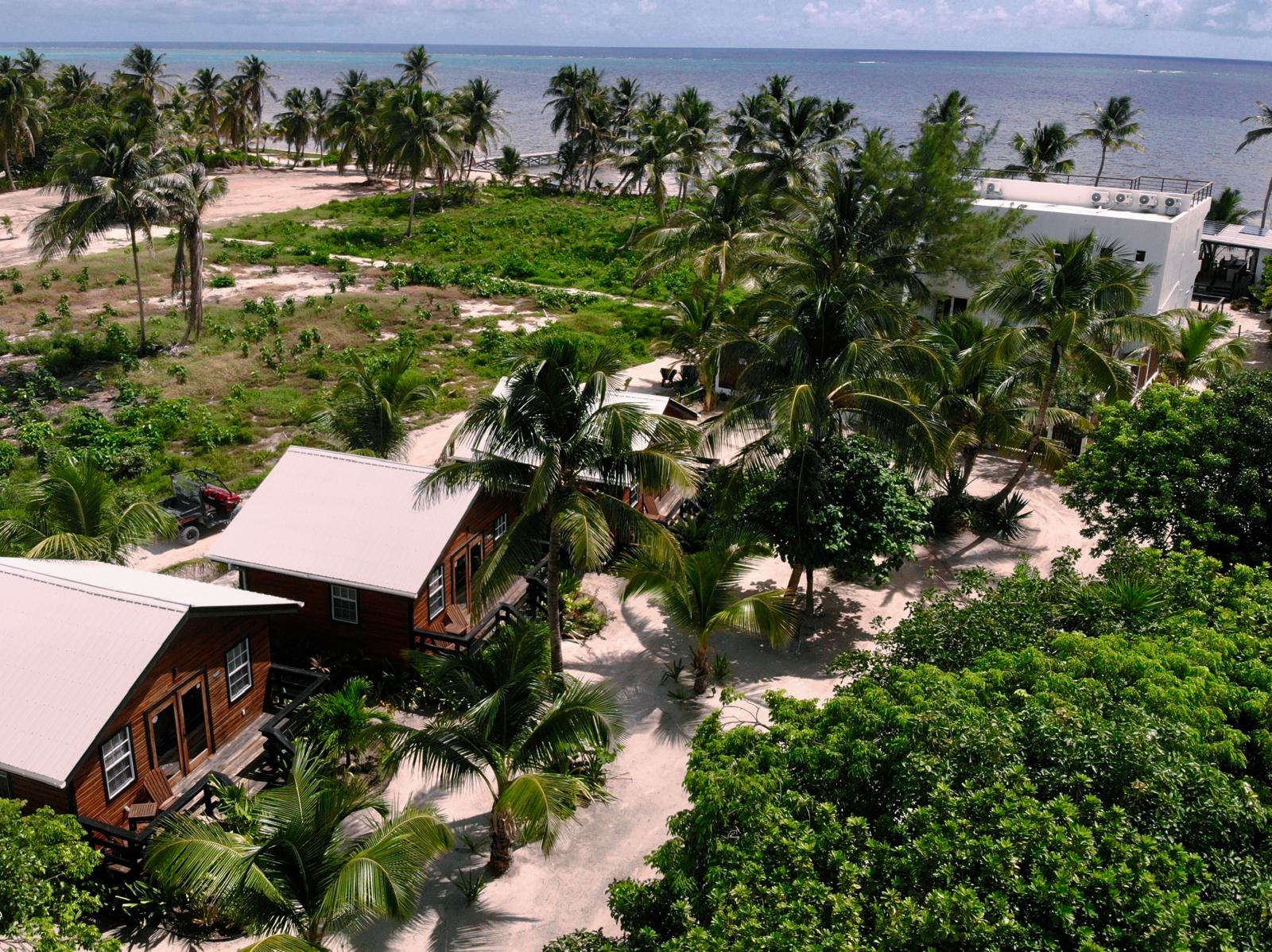 Aerial view of the 3 casitas behind the hotel with lush jungle surroundings