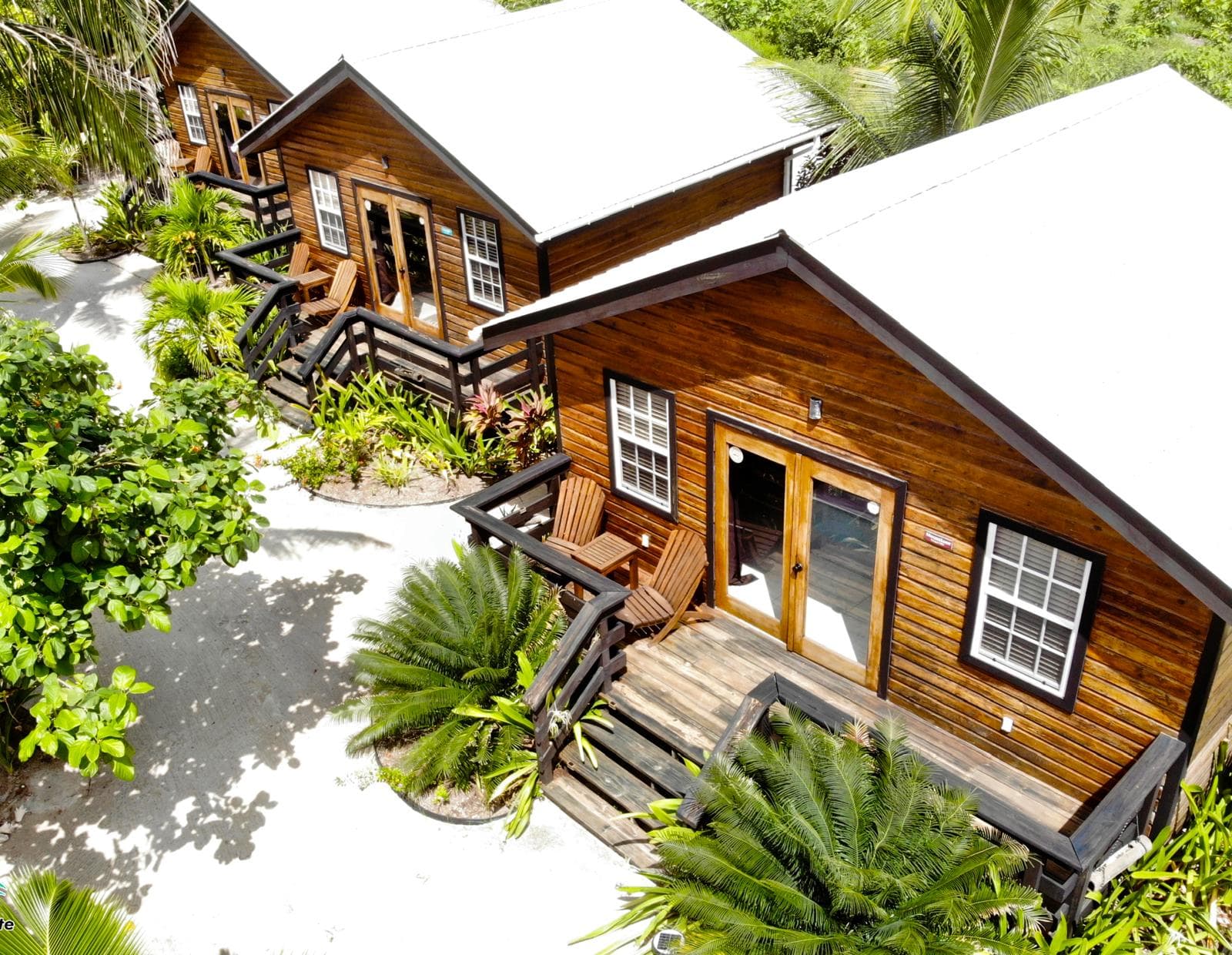 Aerial view of the 3 casitas with lush jungle surroundings