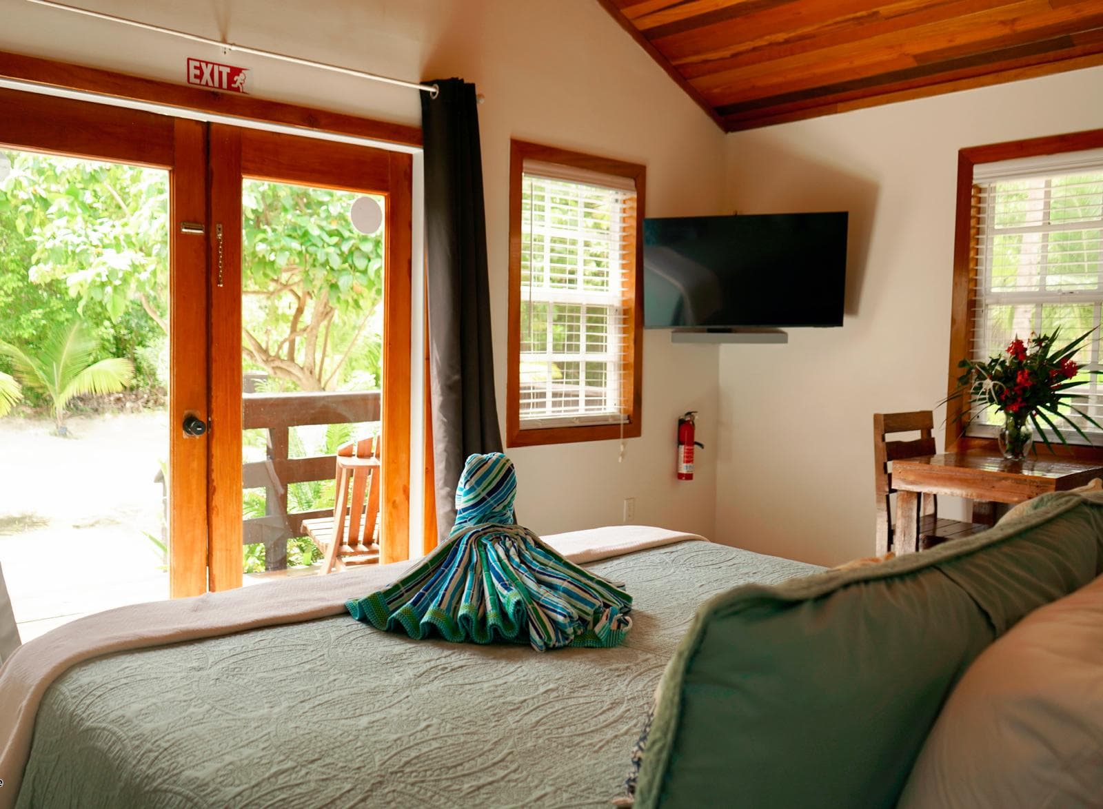 Casita with king sized bed, TV, and dining table